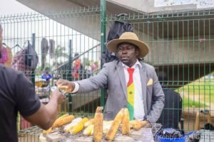 Sosu Patrick attends to customer (photo by (Kobby Blay)