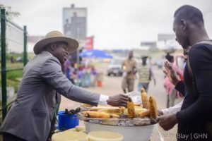 Mr. Patrick negotiates with a customer (photo by (Kobby Blay)