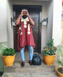 Noble on Agbada With a ripped denim jean