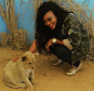Daniella Okeke Poses With Baby Lion