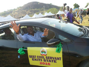 gov-fayose-presents-brand-new-car-to-woman-who-emerged-best-civil-servant-in-ekiti2