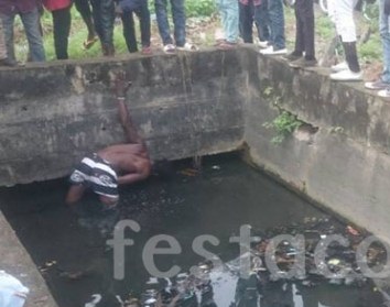 In order to evade jungle justice by an angry mob, a thief had to jump into a canal earlier today in Festac Town, Lagos. The young man and one other were caught stealing motor parts from cars at 1st avenue, Festac Town. According to Festac Online, one of the suspects escaped while the other suspect jumped into a canal and was later caught by residents of the area. Thief Jumps Into A Canal In Festac Town, Lagos To Evade Jungle Justice. Photos Jungle justice was however averted as the security operative came to the scene and the suspect was handed over to the Police. Thief Jumps Into A Canal In Festac Town, Lagos To Evade Jungle Justice. Photos Thief Jumps Into A Canal In Festac Town, Lagos To Evade Jungle Justice. Photos