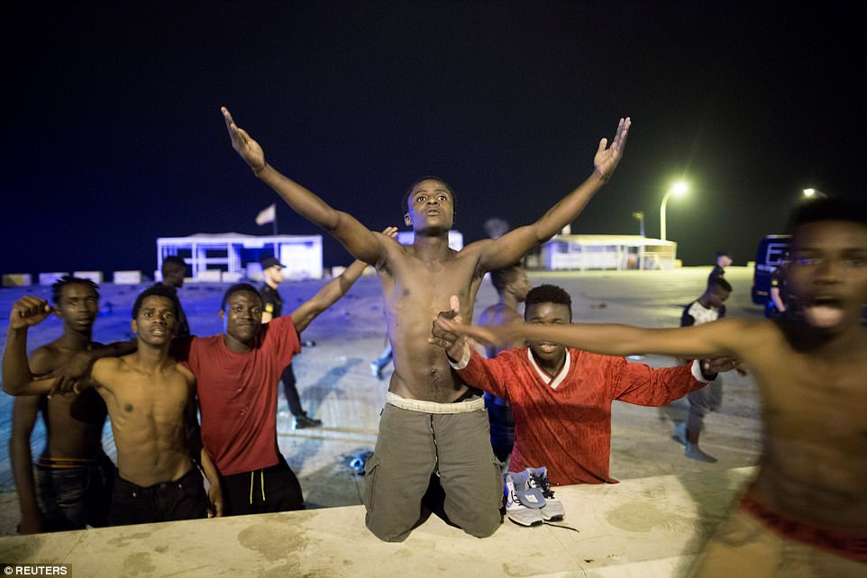 African Migrants Rejoice After Passing Border Between Spain And Morocco. Photos