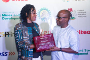 L-R: Bekeme Masade, Convener SITEI and Founder CSR-in-Action presenting a recognition plaque to Waziri Adio - Executive Secretary, Nigeria Extractive Industries Transparency Initiative (NEITI)