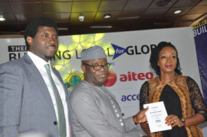 L-R: Meka Olowola; Dr. Kayode Fayemi - the Minister of  Mines & Steel Development receiving a plaque from Bekeme Masade