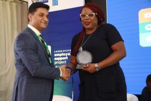 Amit Washington, CEO, Arc Skills Nigeria presenting a plaque to one of the entertainment sector panelists, Bose Oshin, CEO, G.A.M.E Productions at the Lagos State Employability Support Project Entertainment Sector Industry Engagement held at The Civic Centre, Victoria Island, Lagos on Friday.